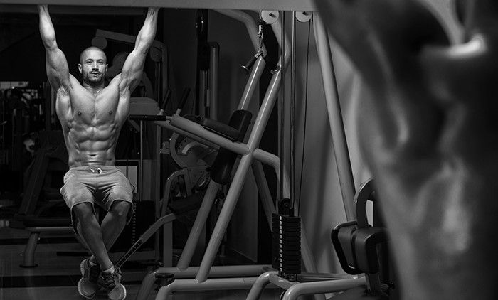 A man performing Pull Up Knee Raises