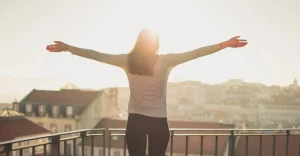 Women Standing Facing the Sun